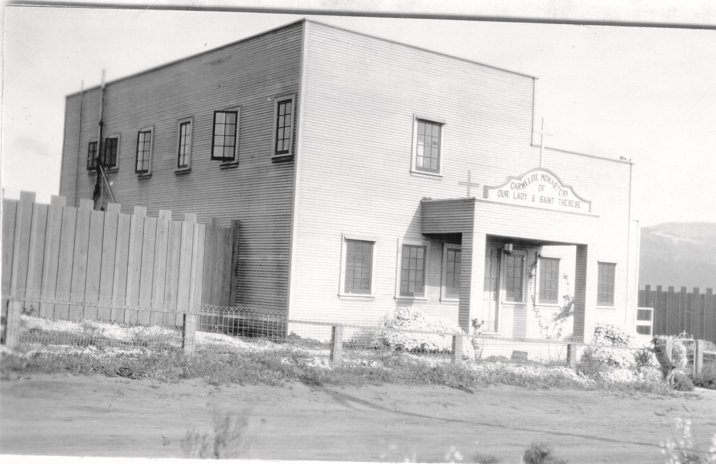 A black and white photo of an old building.