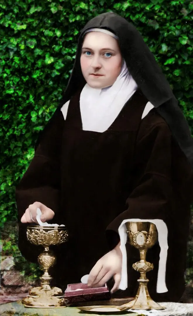 A nun holding a cup and bowl in her hands.