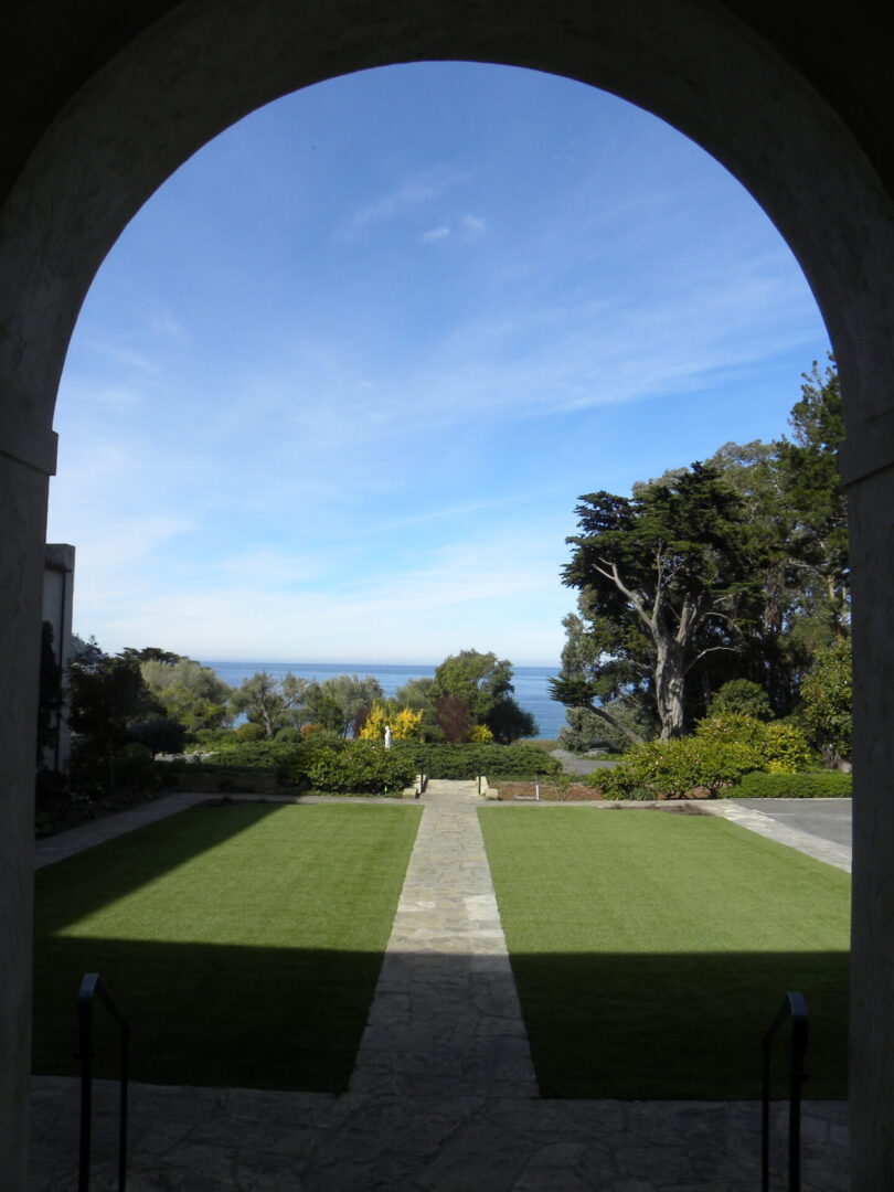 A view of the ocean from an archway.