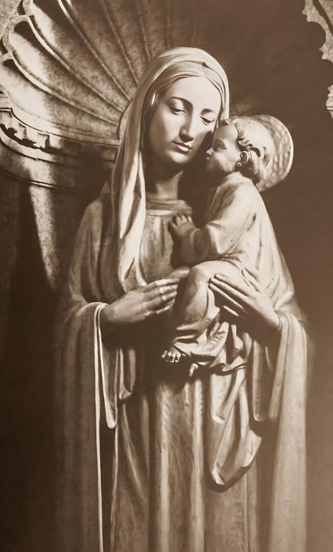 A statue of mary holding jesus in her arms.